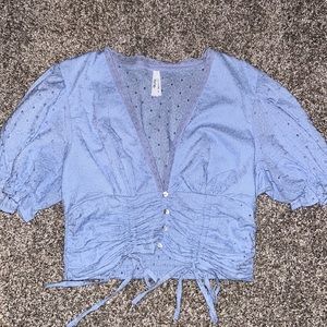 Light blue cropped top. Size Large.